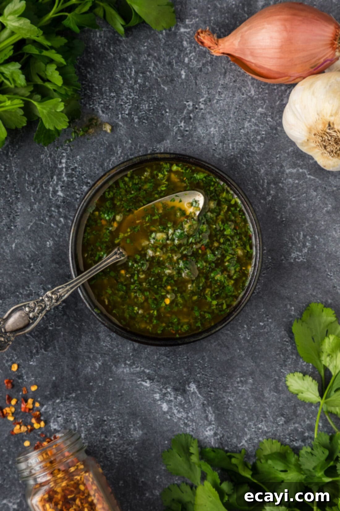 Chimichurri Sauce 3 Bowl of Chimichurri sauce with a spoon for serving