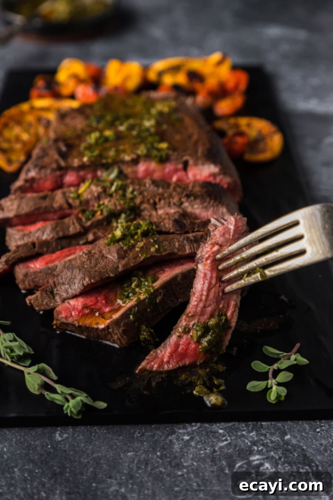 The Butcher's Secret Steak 3 Piece of Flat Iron Steak on a fork