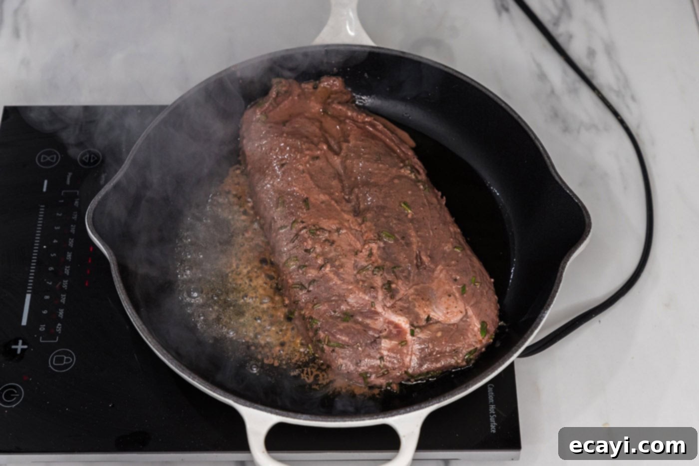 The Butcher's Secret Steak 7 searing flat iron steak in a skillet