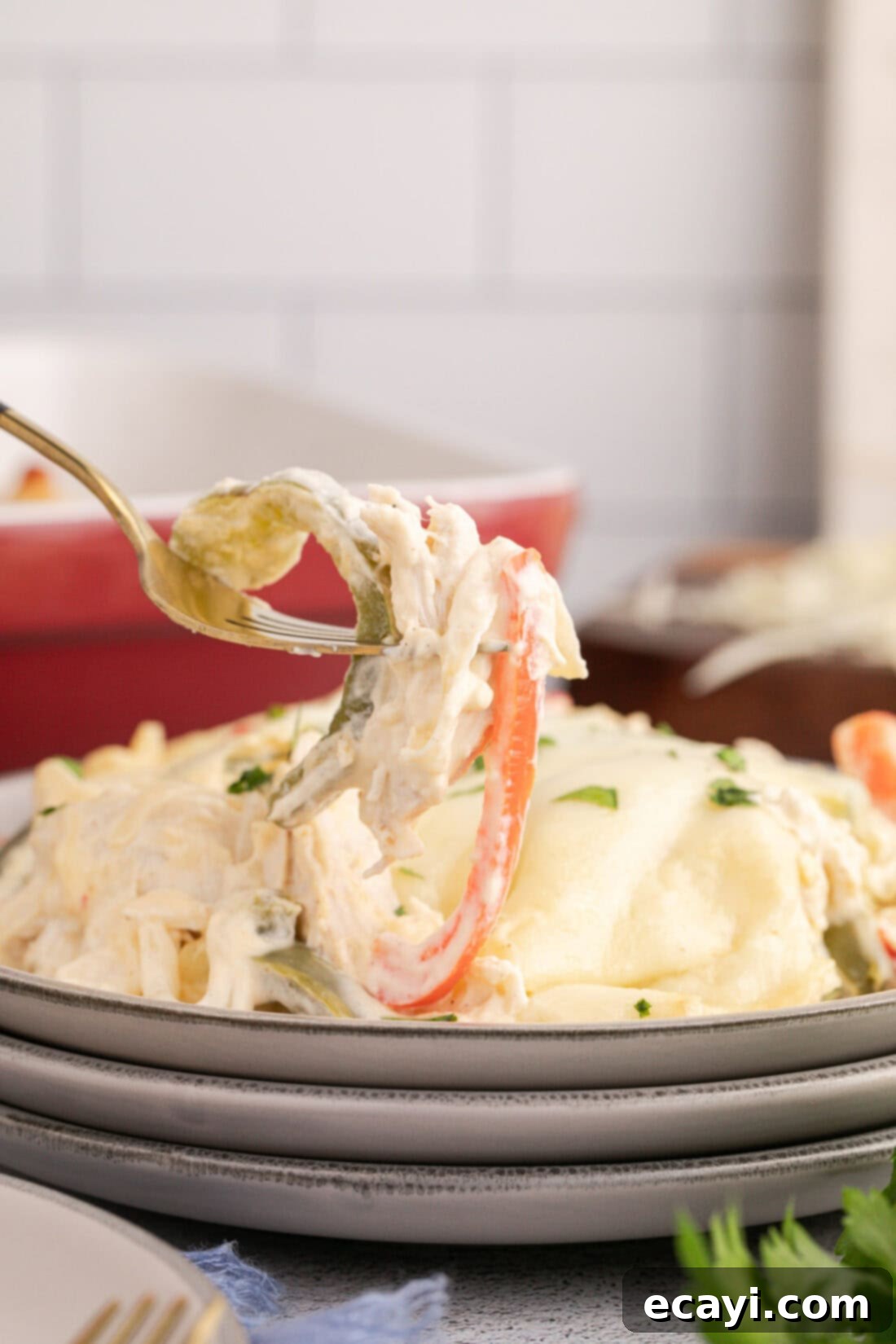 Cheesy Philly Chicken Bake 3 Forkful of Philly Chicken Cheesesteak Casserole held above a plate