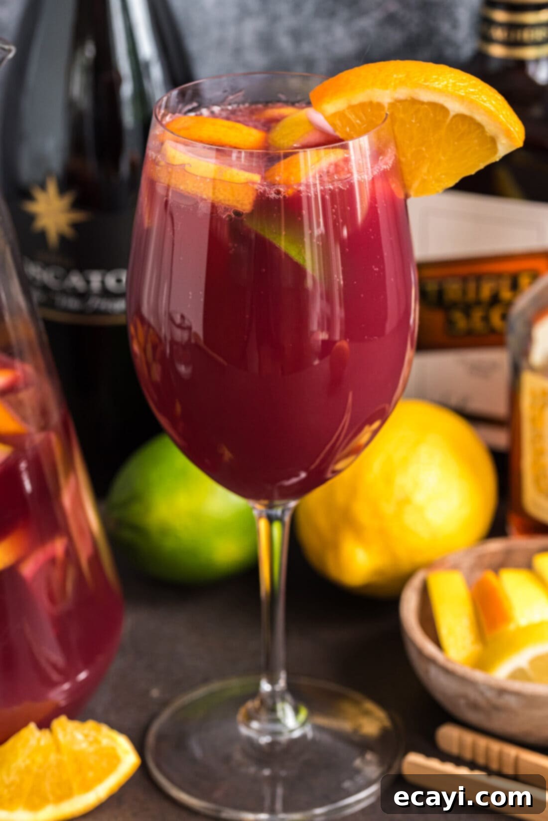 Mexican Fiesta Sangria 3 Close-up of a glass of refreshing Mexican Inspired Sangria garnished with orange and lime slices