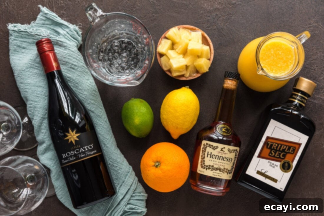 Mexican Fiesta Sangria 4 Assortment of fresh ingredients for Mexican Inspired Sangria, including Red Moscato wine, brandy, triple sec, orange juice, and vibrant citrus fruits