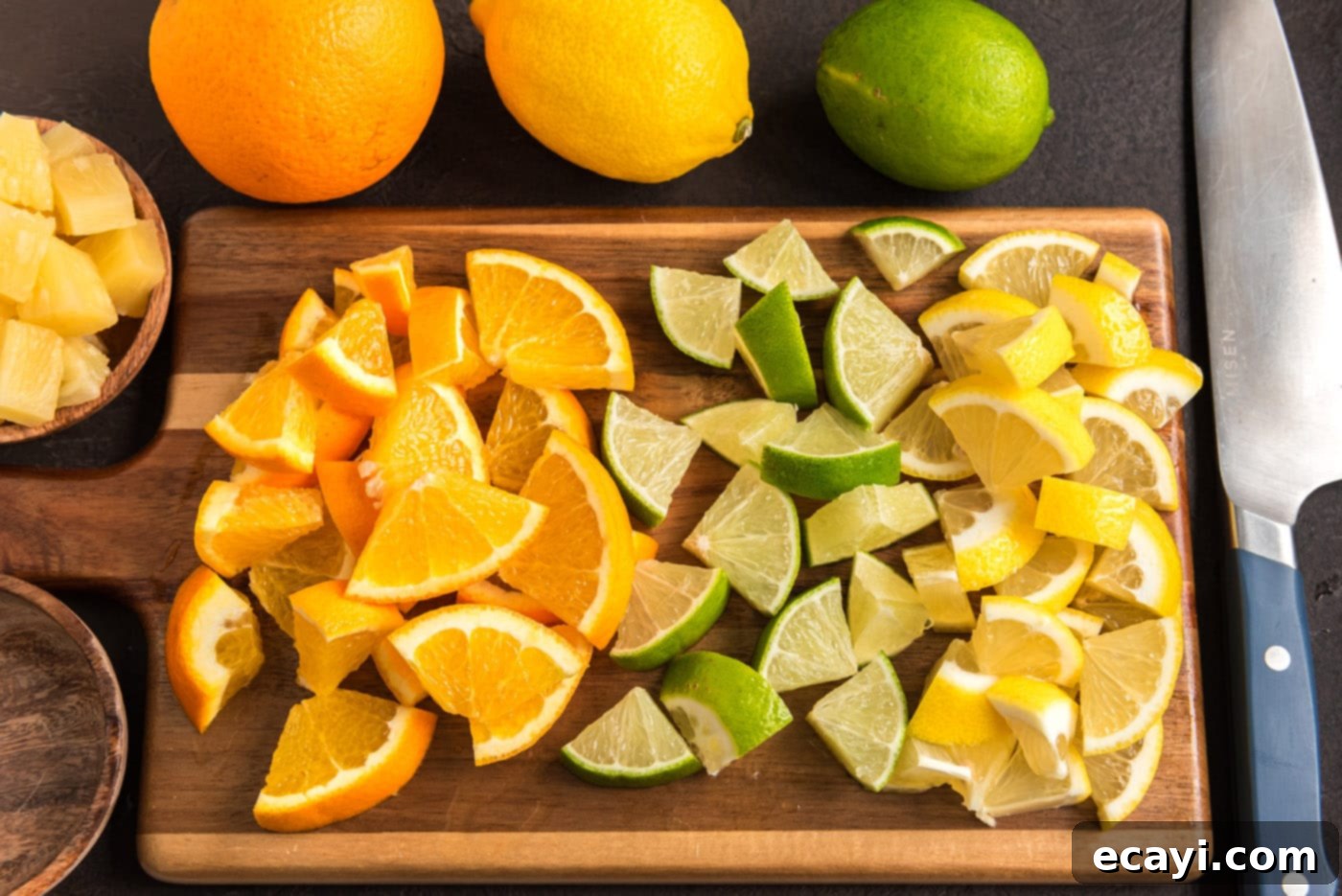 Mexican Fiesta Sangria 5 Sliced oranges, limes, and lemons neatly arranged on a cutting board, ready for making Mexican sangria