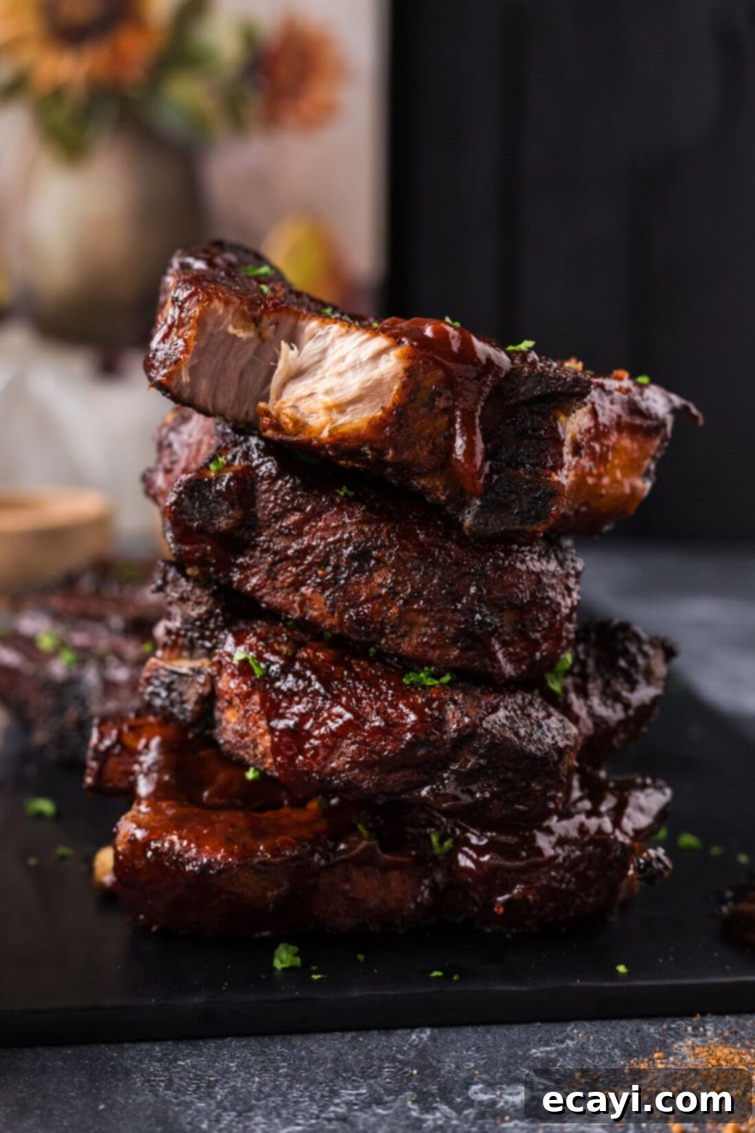 Down-Home Country Ribs 2 Stack of perfectly cooked Country Style Ribs on a plate, ready to be devoured.