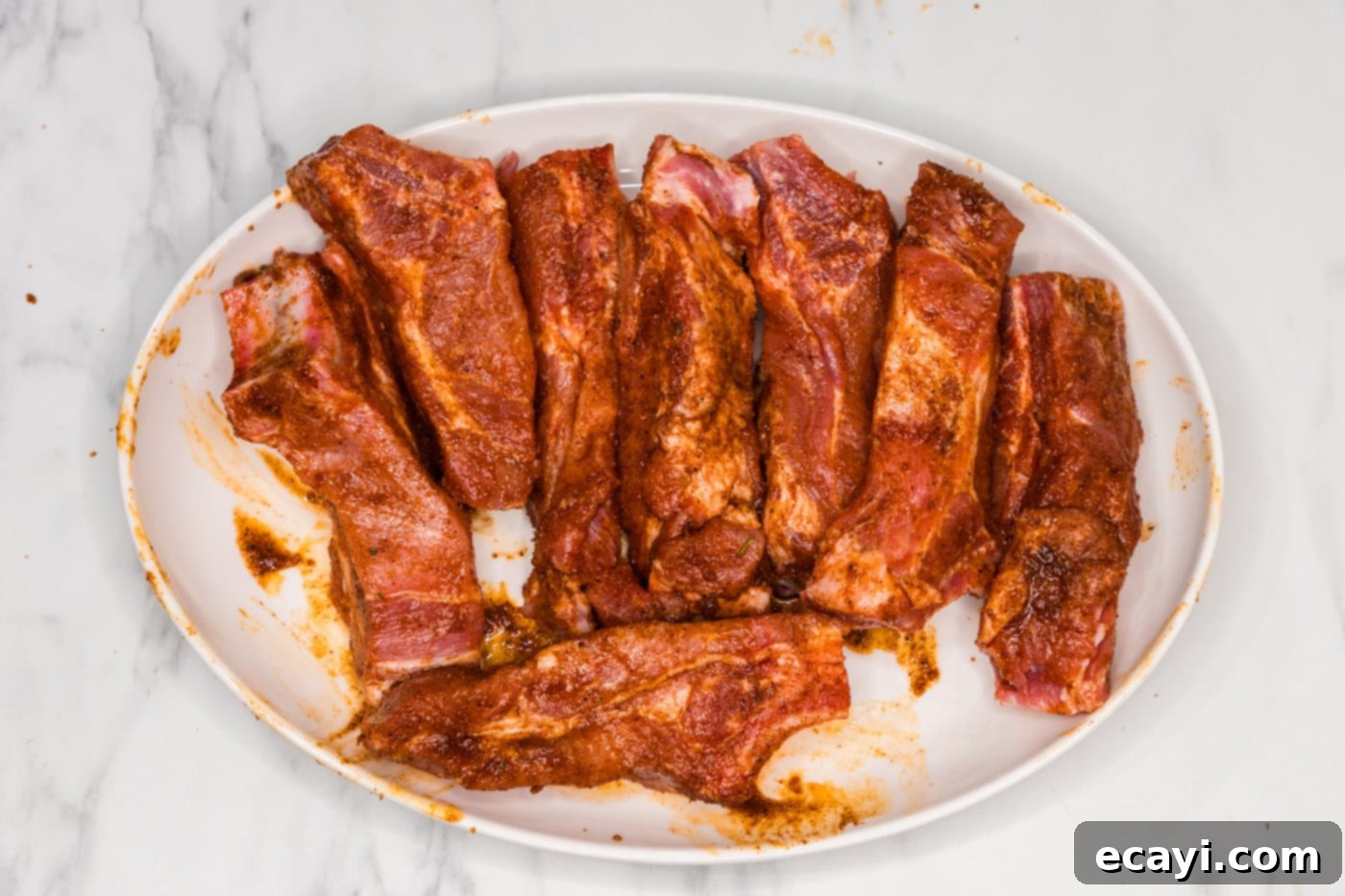Down-Home Country Ribs 7 wet rubbed country style ribs, showcasing the fully coated meat