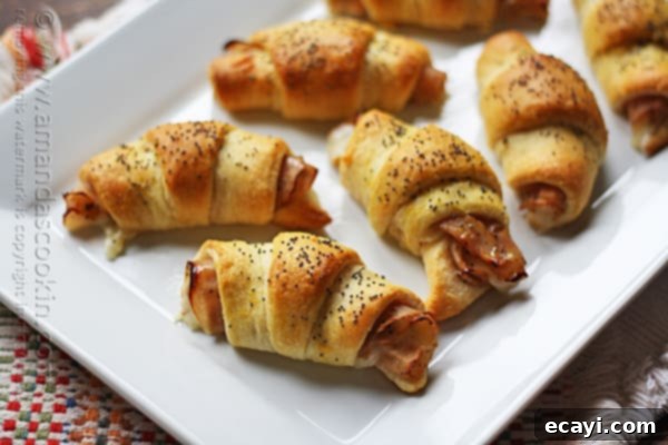 Quick, easy, and delicious Turkey Pepper Jack Roll Ups on a plate. Turkey Pepper Jack Roll Ups neatly arranged on a white plate