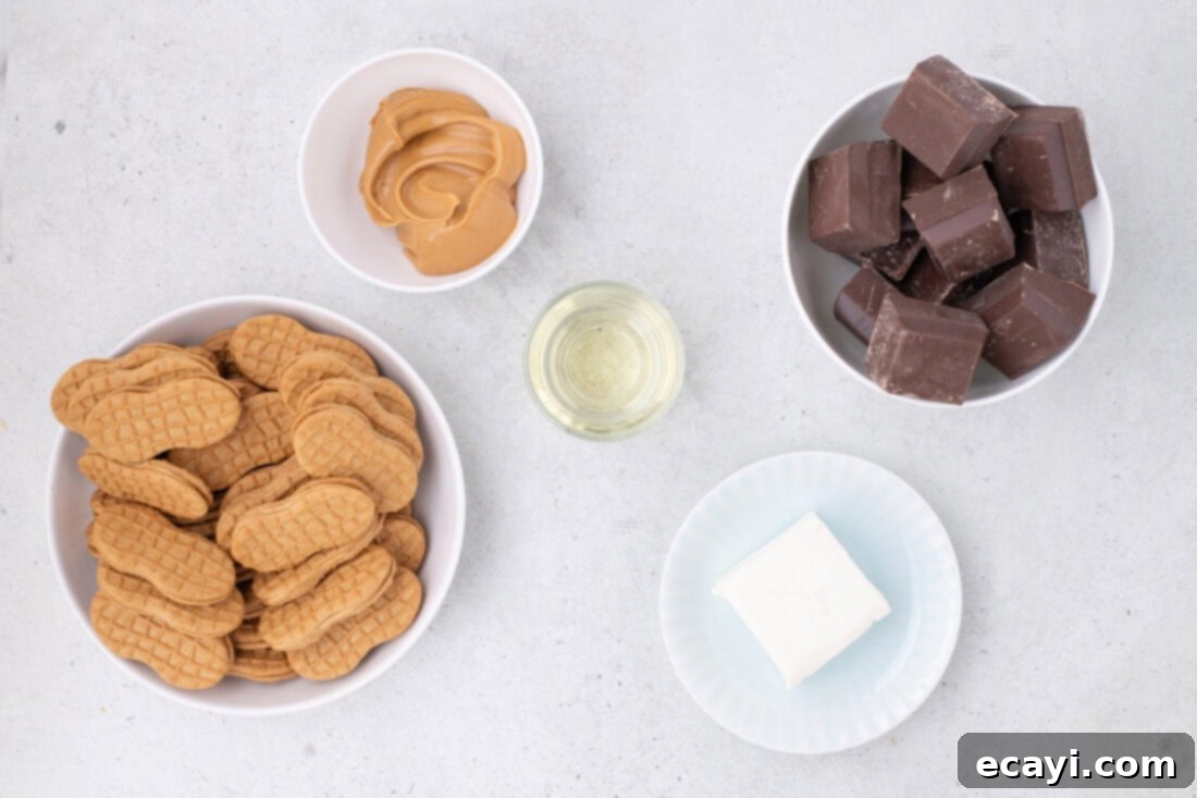 Peanut Butter Truffle Bites 4 All the ingredients for Nutter Butter Balls laid out: Nutter Butter cookies, cream cheese, peanut butter, almond bark, and vegetable oil.