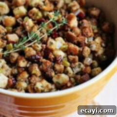 Aromatic Herb Stuffing 9 A close up of a bowl of stuffing with parsley, sage, rosemary and thyme.