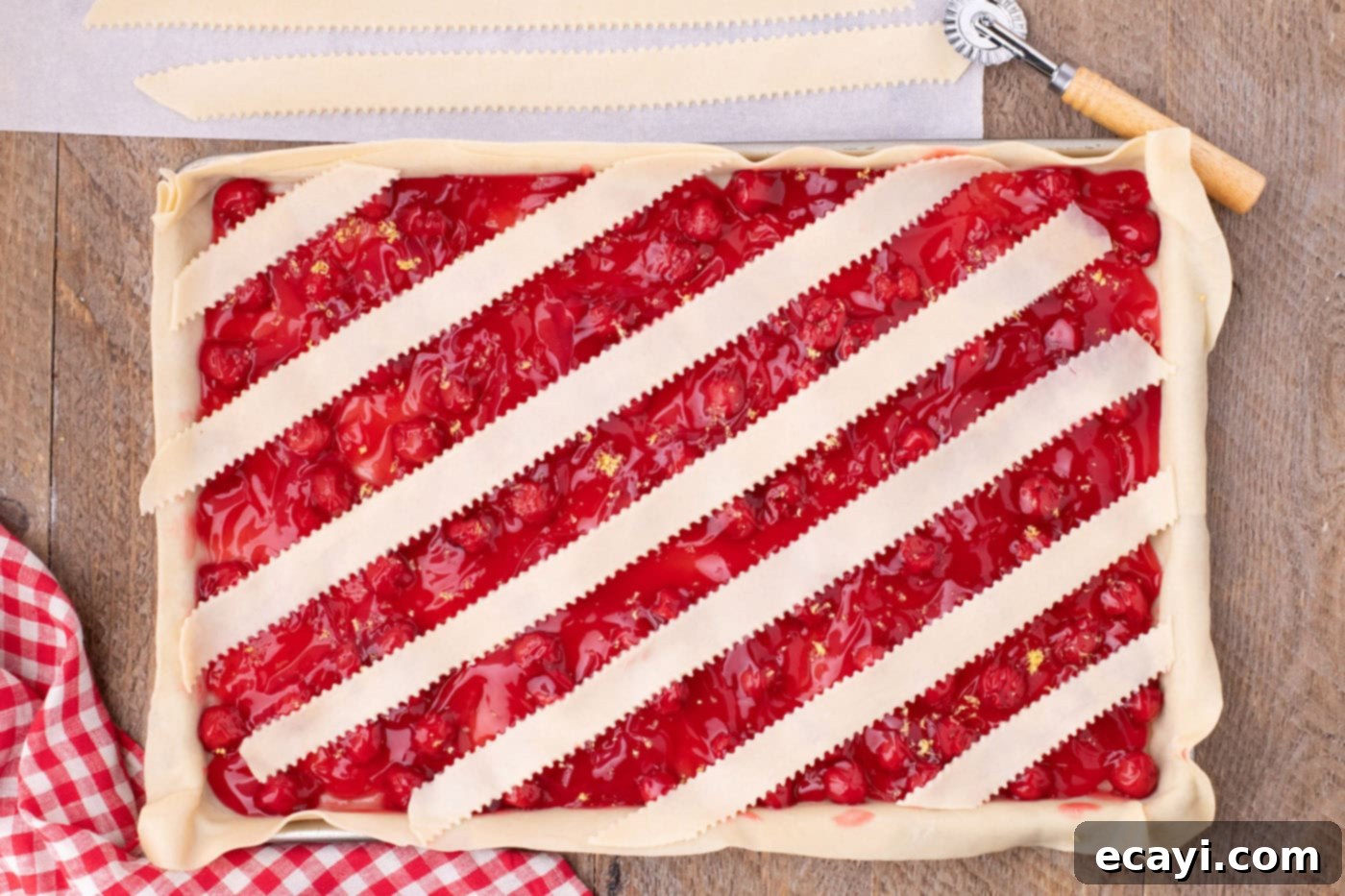 Sheet Pan Cherry Pie 11 layering strips of pie crust over slab pie horizontally