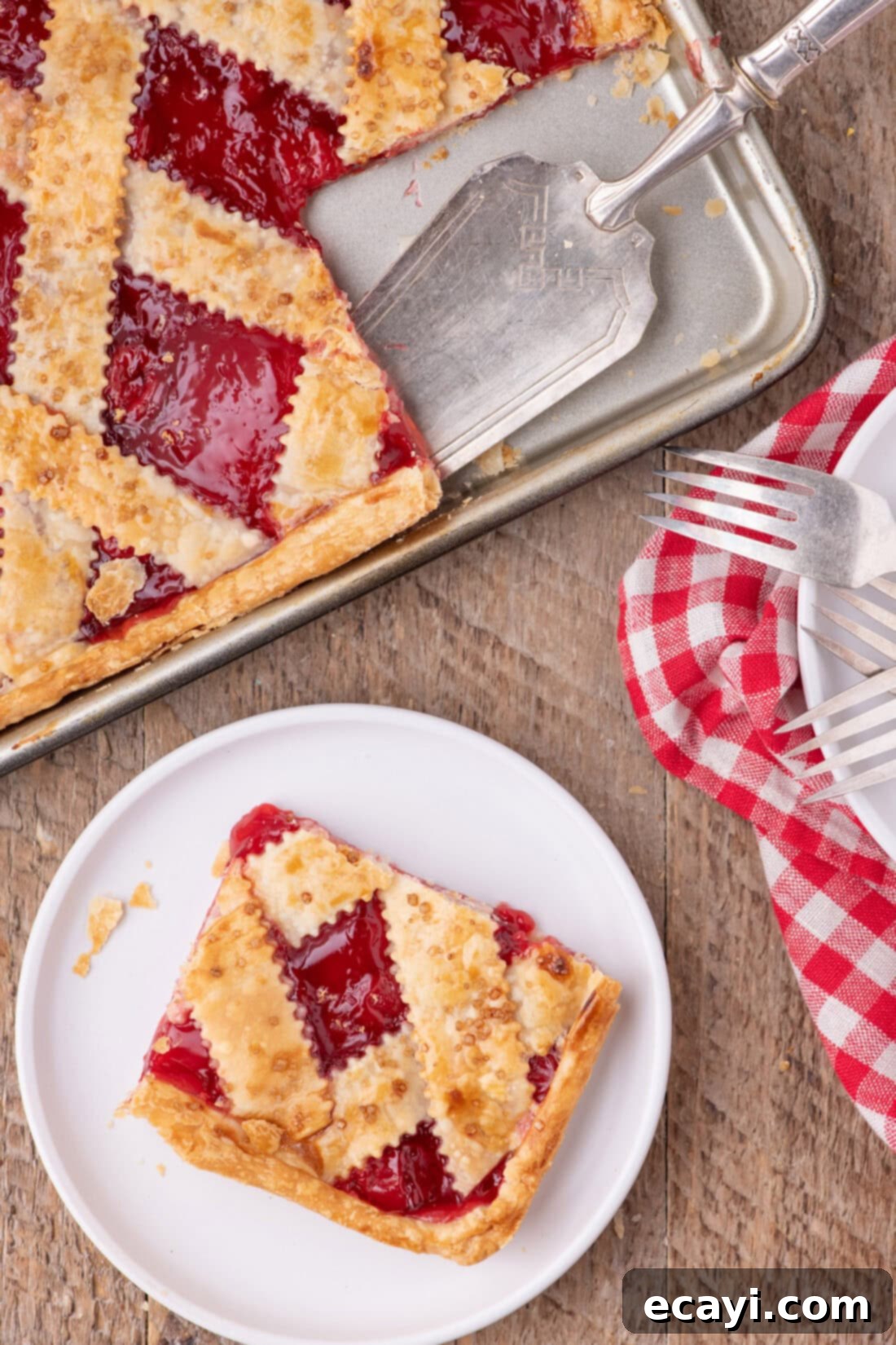 Sheet Pan Cherry Pie 3 Slice of Cherry Slab Pie on a plate with the slab pie above it