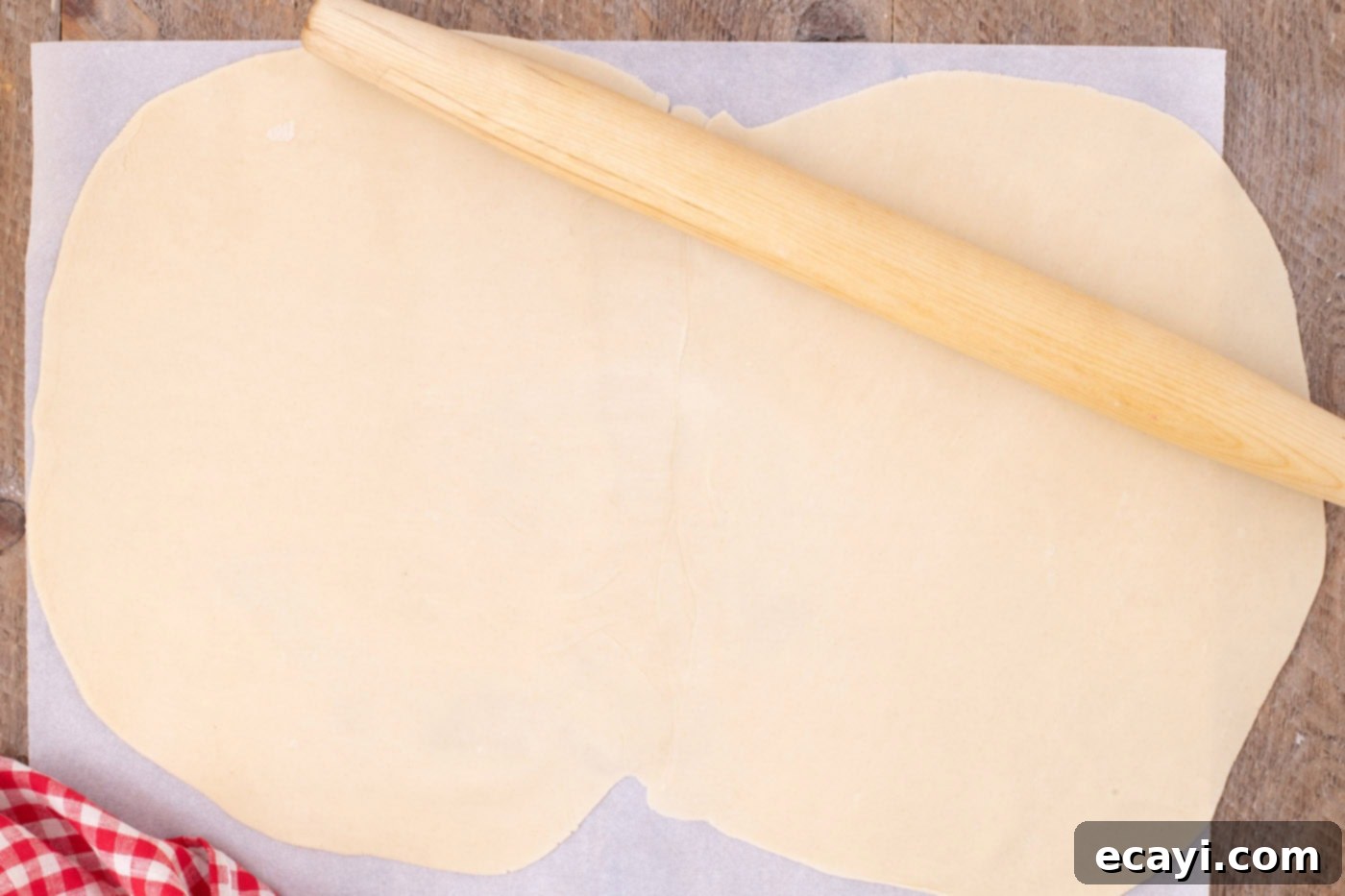 Sheet Pan Cherry Pie 6 rolling together premade pie crusts with a rolling pin