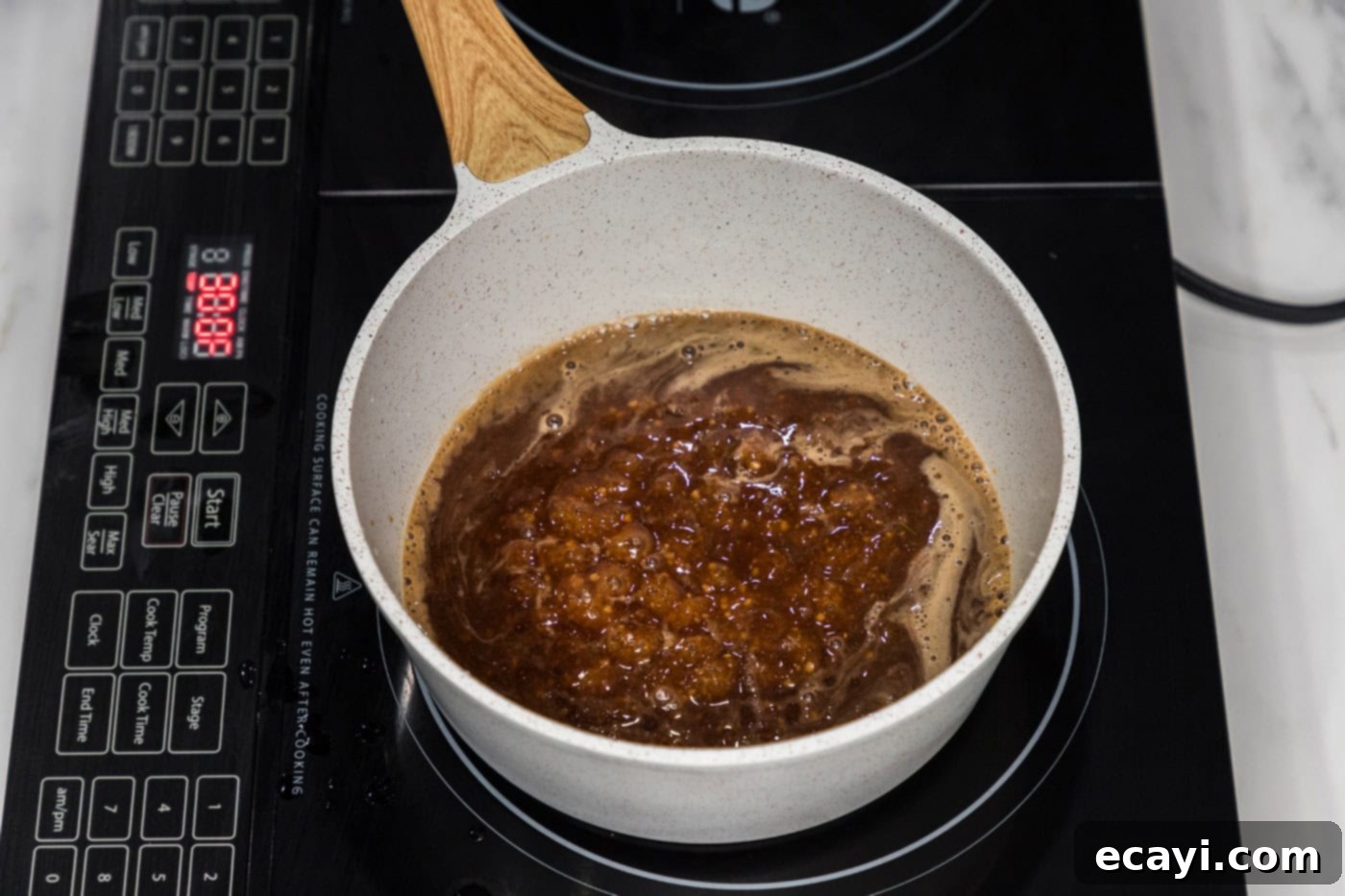Sticky Honey Garlic Tofu 11 honey garlic sauce in a saucepan