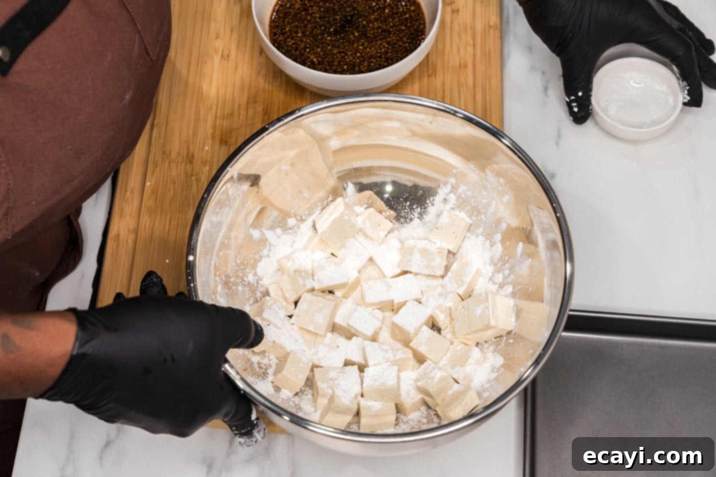 Sticky Honey Garlic Tofu 7 tossing tofu cubes with cornstarch
