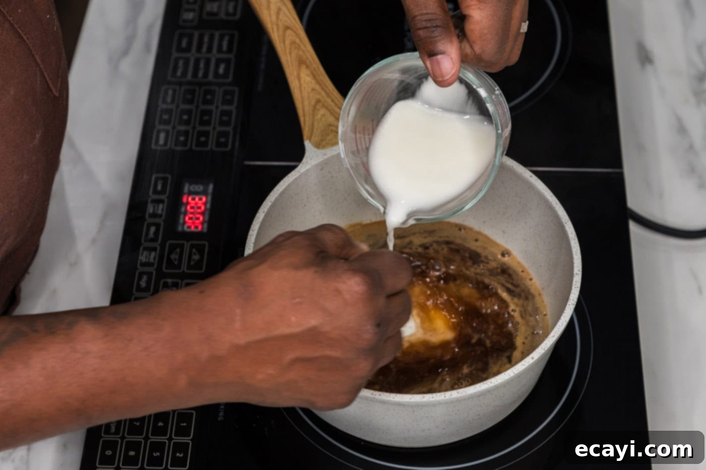 Sticky Honey Garlic Tofu 10 whisking cornstarch slurry into honey garlic sauce in a saucepan