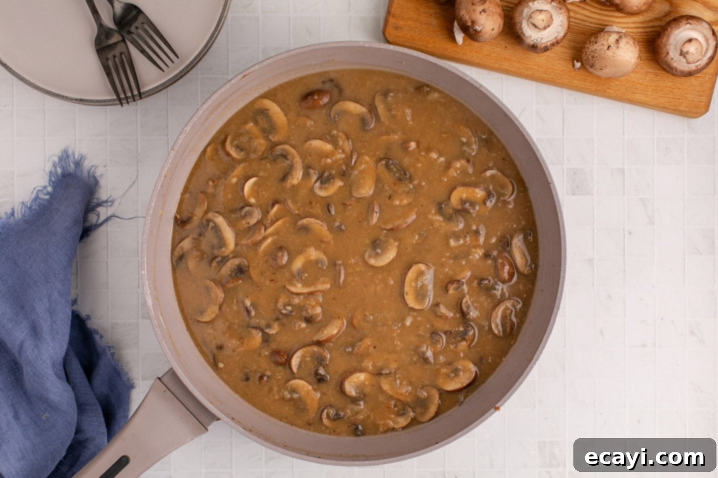 Hearty Salisbury Steak Meatballs 13 finished Salisbury steak gravy simmering in a skillet, thick and rich