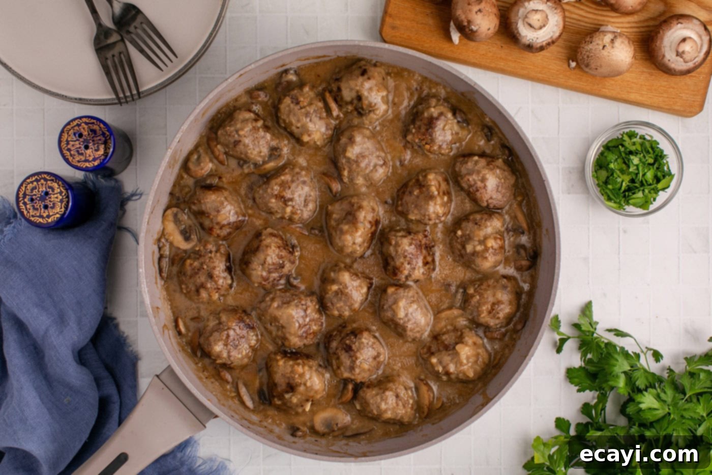 Hearty Salisbury Steak Meatballs 14 finished overhead shot of Salisbury steak meatballs perfectly coated in gravy in a skillet