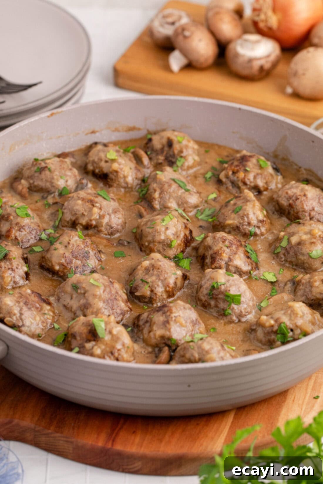 Hearty Salisbury Steak Meatballs 15 A large skillet filled with perfectly cooked Salisbury Steak Meatballs, coated in a rich, dark gravy, ready to be served as a hearty meal.
