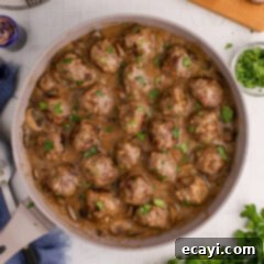 Hearty Salisbury Steak Meatballs 16 Overhead photo of a skillet of Salisbury Steak Meatballs, glistening with rich homemade gravy.