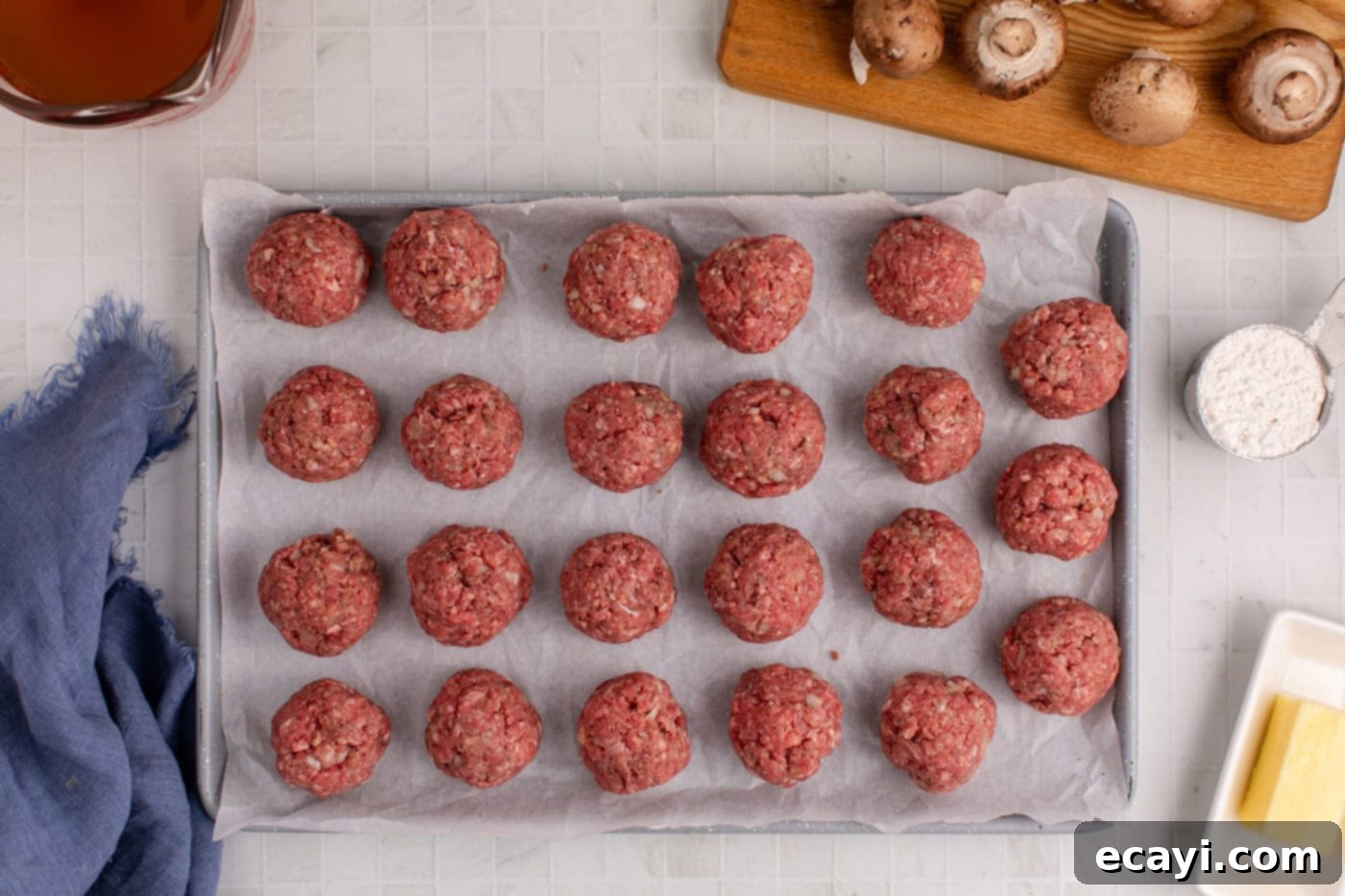 Hearty Salisbury Steak Meatballs 7 perfectly formed meatballs neatly arranged on parchment paper