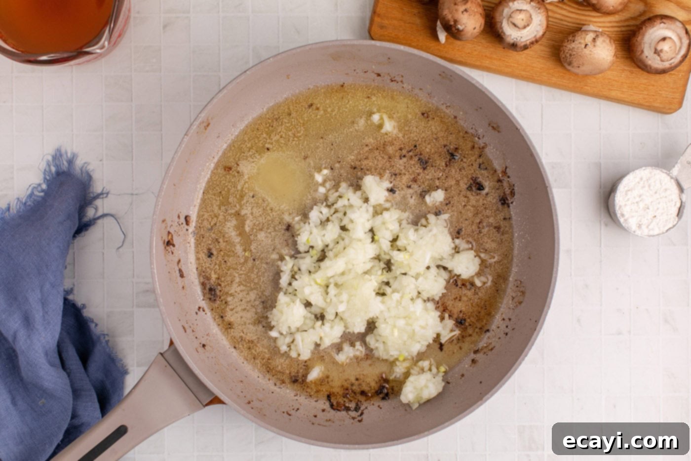 Hearty Salisbury Steak Meatballs 9 chopped onion cooking in a skillet with melted butter, turning soft and fragrant