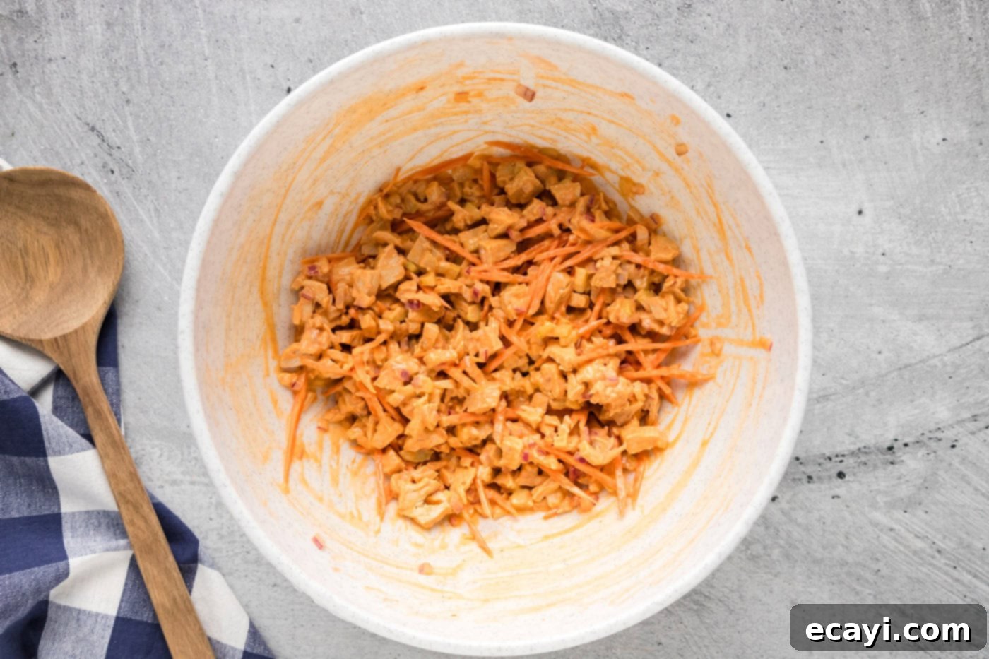 Fiery Buffalo Chicken Bowl 8 easy buffalo chicken salad fully mixed in a large mixing bowl, ready to serve