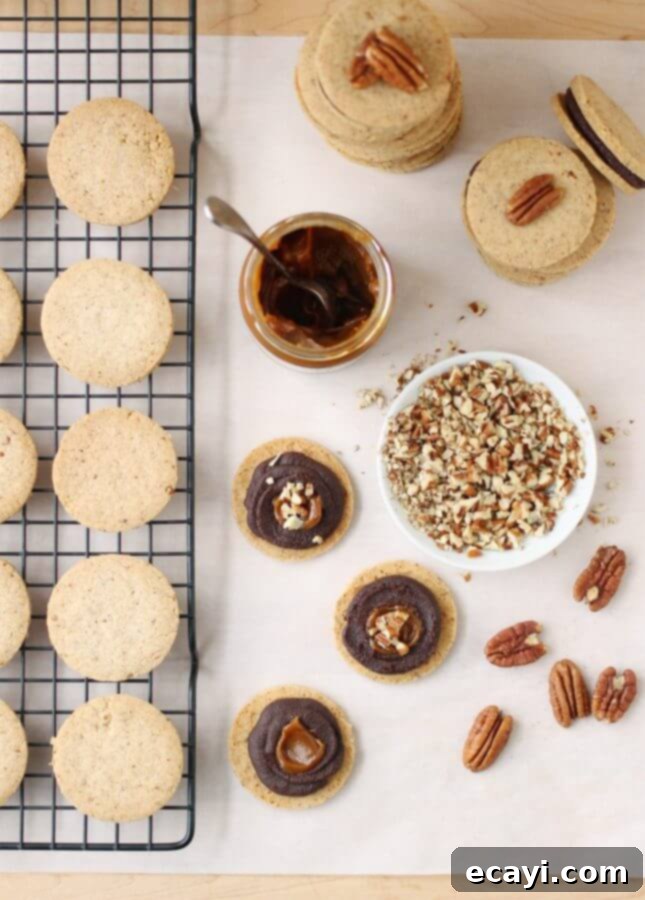 Dark Chocolate Caramel Pecan Shortbread Cookies 3 Pecan Shortbread Cookies with a Dark Chocolate and Caramel Filling // FoodNouveau.com