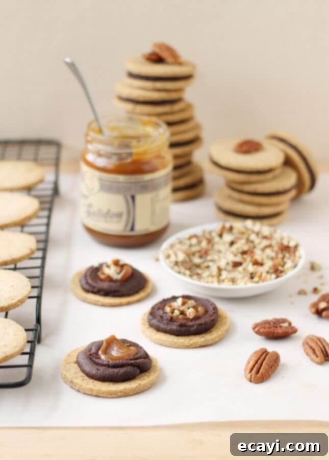 Dark Chocolate Caramel Pecan Shortbread Cookies 6 Pecan Shortbread Cookies with a Dark Chocolate Ganache and Caramel Filling // FoodNouveau.com