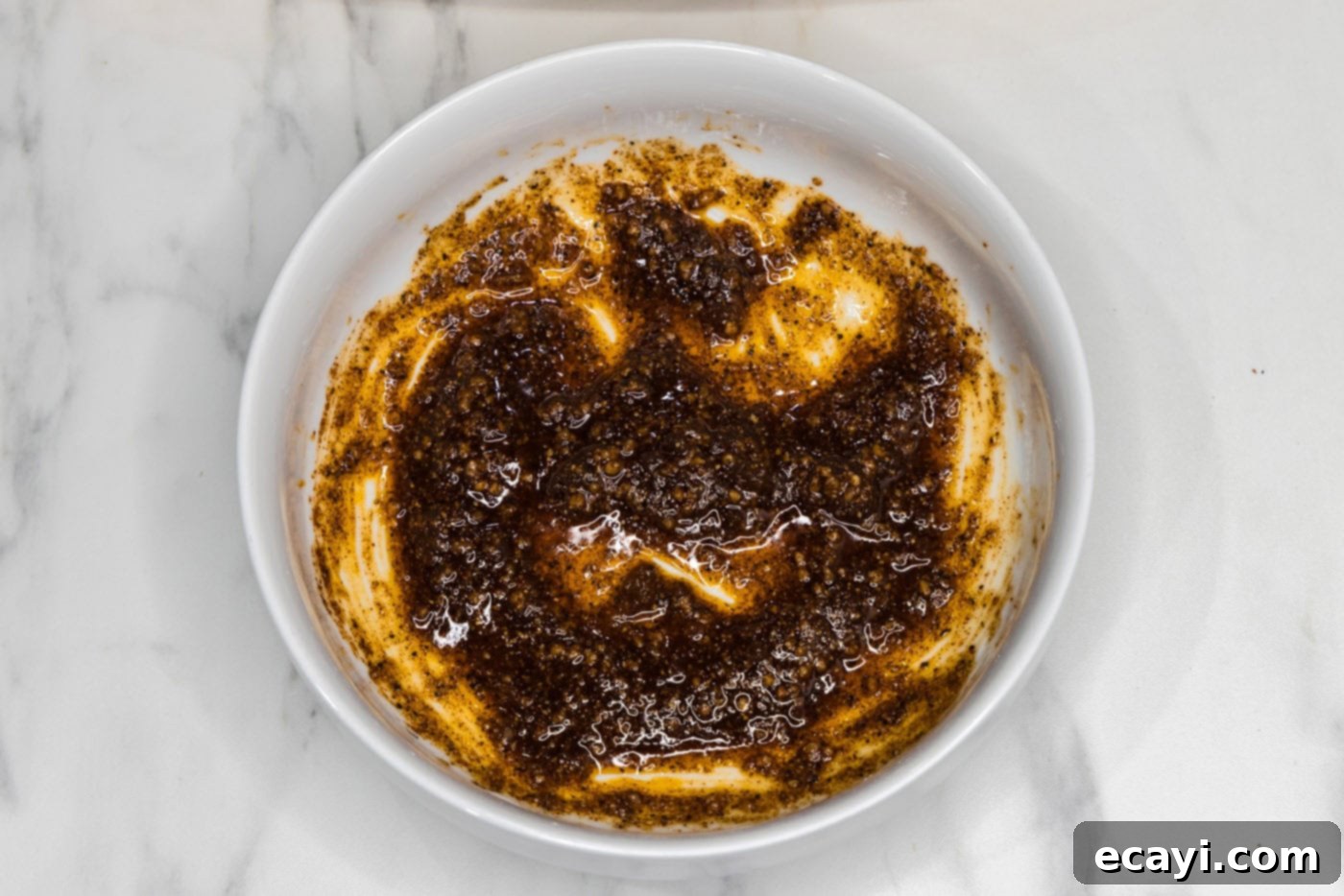 Juicy Beer-Infused Roasted Chicken 6 seasoning rub for chicken in a mixing bowl