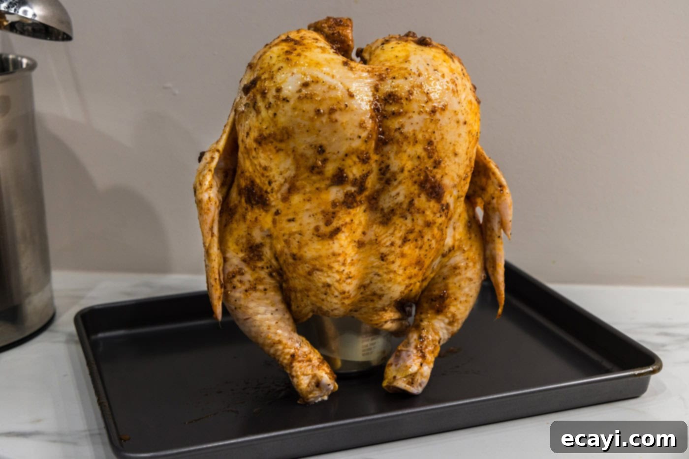 Juicy Beer-Infused Roasted Chicken 8 whole chicken on top of a beer can