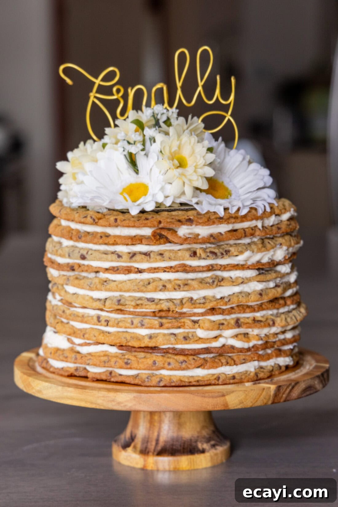 Chocolate Chip Cookie Mountain 2 Photo of a Chocolate Chip Cookie Tower topped with flowers and a cake topper that says finally