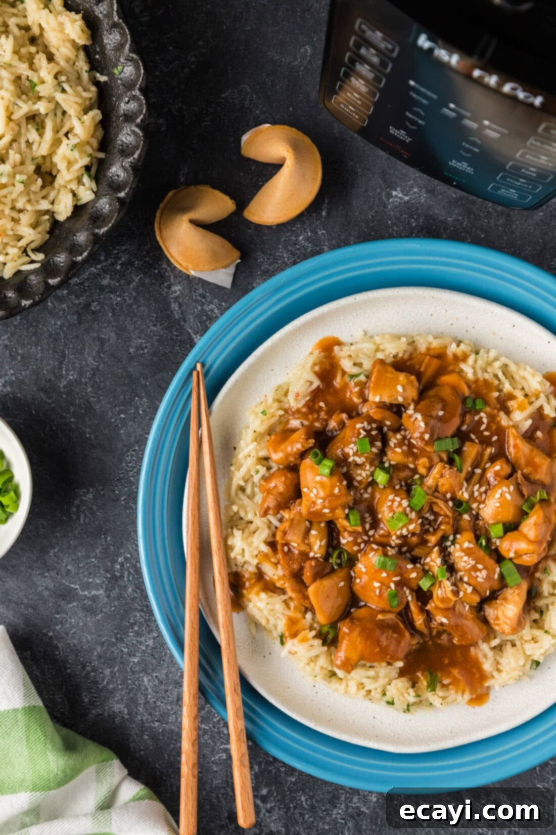 Bourbon Glazed Instant Pot Chicken 2 Delicious Instant Pot Bourbon Chicken served with fluffy rice and fortune cookies, ready for an easy weeknight meal.