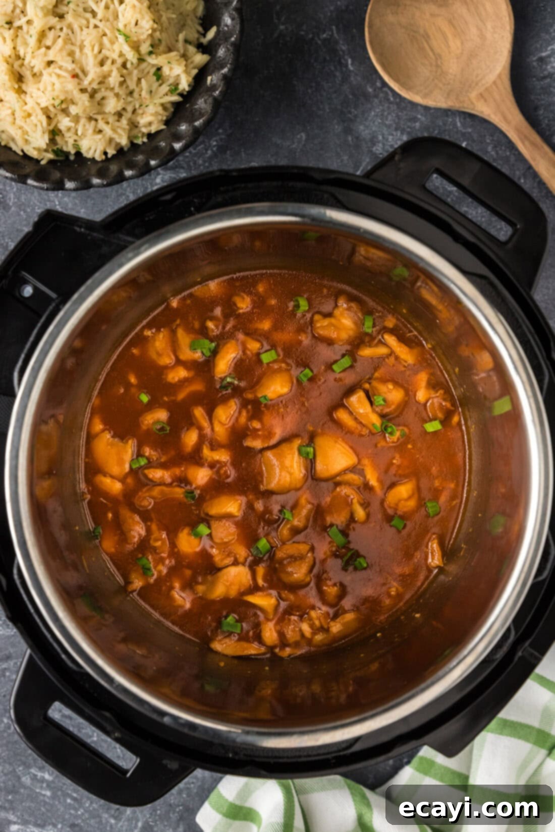 Bourbon Glazed Instant Pot Chicken 3 Instant Pot filled with juicy bourbon chicken pieces simmering in a rich, sticky sauce.