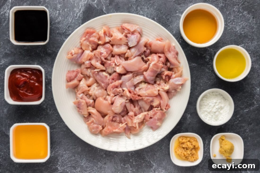 Bourbon Glazed Instant Pot Chicken 4 Fresh ingredients laid out for making Instant Pot Bourbon Chicken, including chicken thighs, bourbon, honey, and spices.