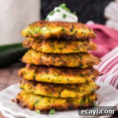 Crispy Zucchini Delights 13 Close up photo of a stack Zucchini Fritters on a plate