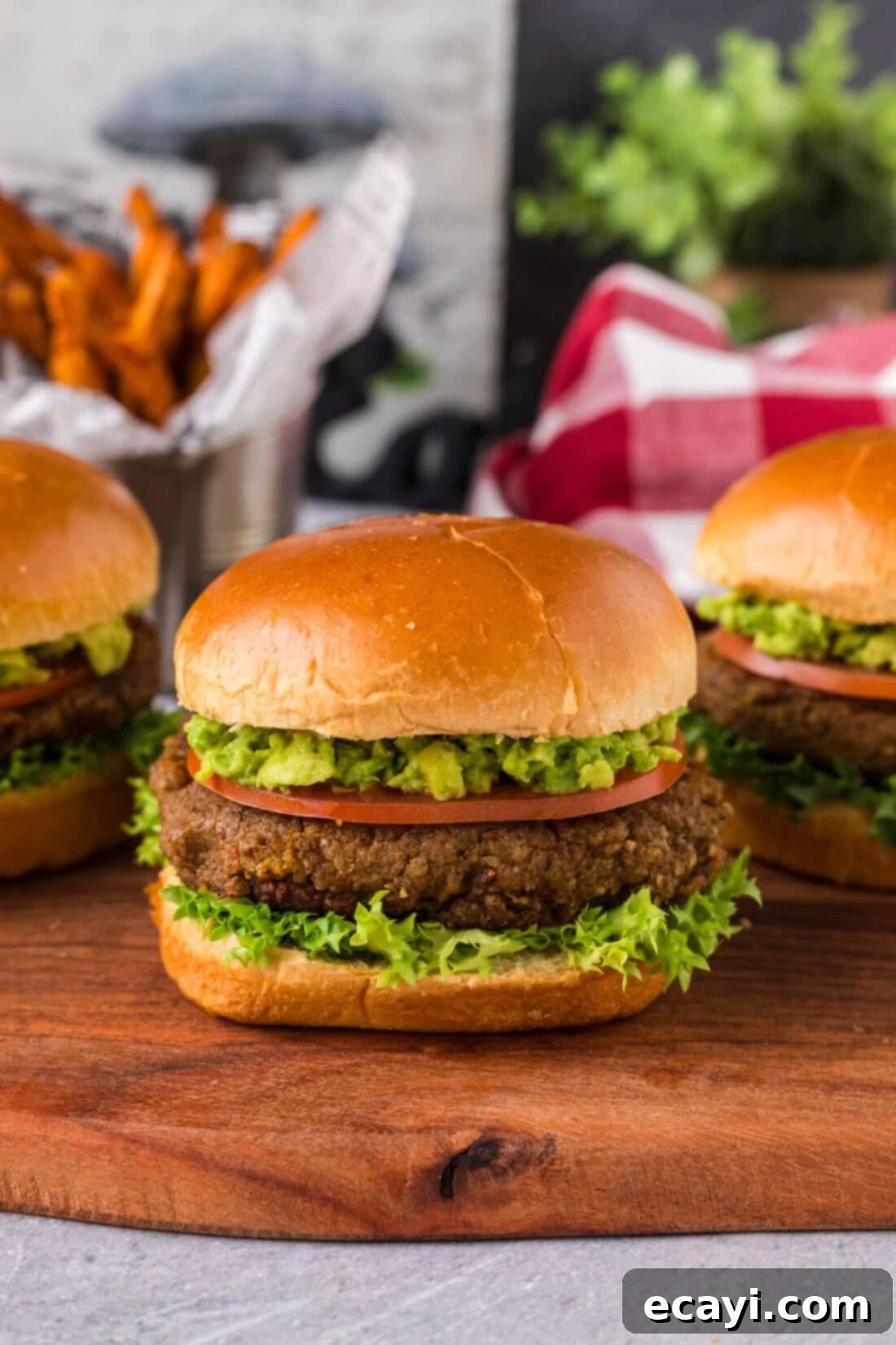 Plant-Based Burgers 2 Close up photo of a Veggie Burger with more in the background