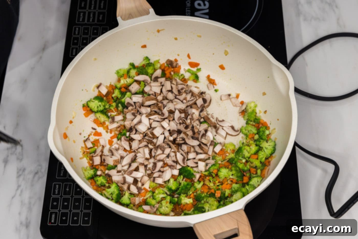 Plant-Based Burgers 5 broccoli and mushrooms added to skillet with carrots and garlic