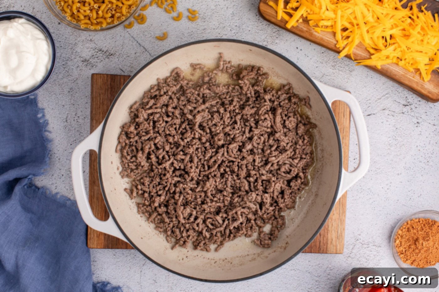 Taco Mac 'n' Cheese 5 ground beef cooked in a skillet until browned
