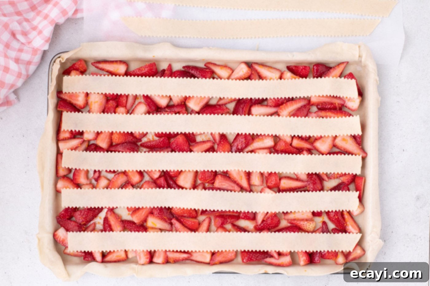 Strawberry Sheet Pan Delight 13 five long strips of pie crust laid horizontally over the strawberry filling