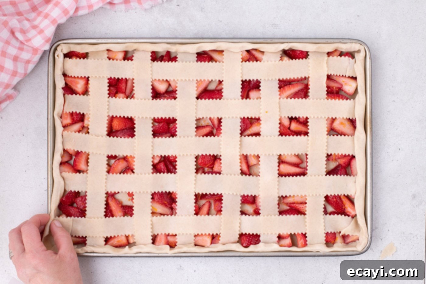 Strawberry Sheet Pan Delight 17 strawberry slab pie with a finished lattice top and crimped edges