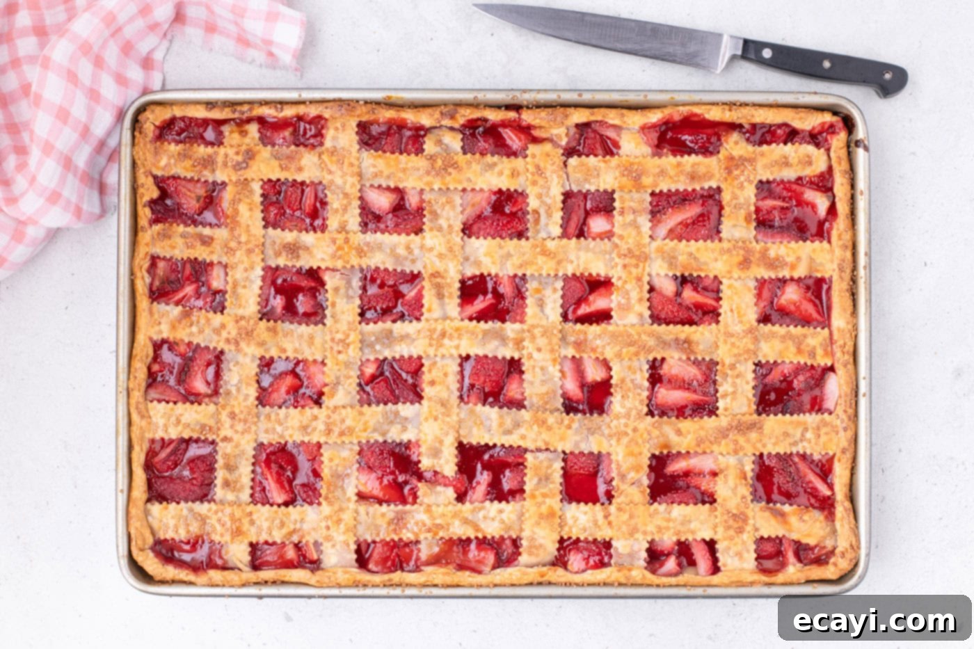 Strawberry Sheet Pan Delight 19 baked overhead of strawberry slab pie, golden brown and bubbling