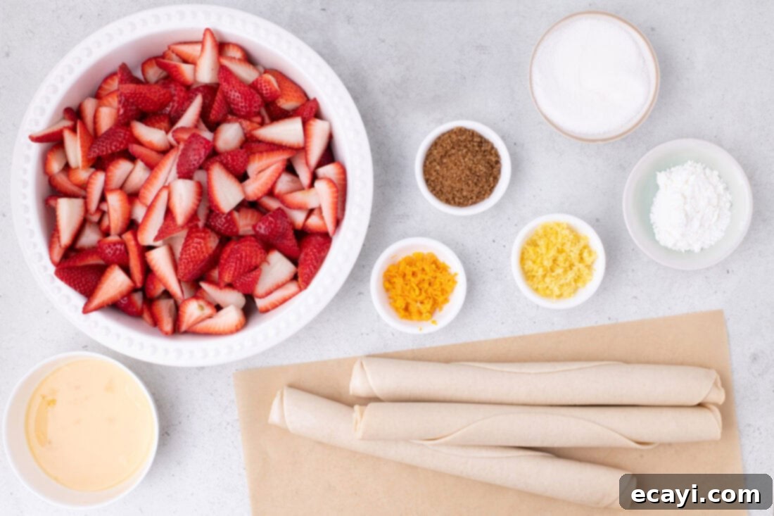 Strawberry Sheet Pan Delight 4 A flat lay photo of fresh strawberries, pie crusts, sugar, cornstarch, and citrus zests on a wooden surface.