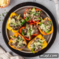 Loaded Philly Cheesesteak Peppers 10 Close up photo of a plate of Philly Cheesesteak Stuffed Peppers
