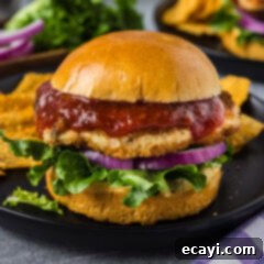 Zesty Shrimp Burger 16 A delicious homemade shrimp burger on a plate, ready to be enjoyed.