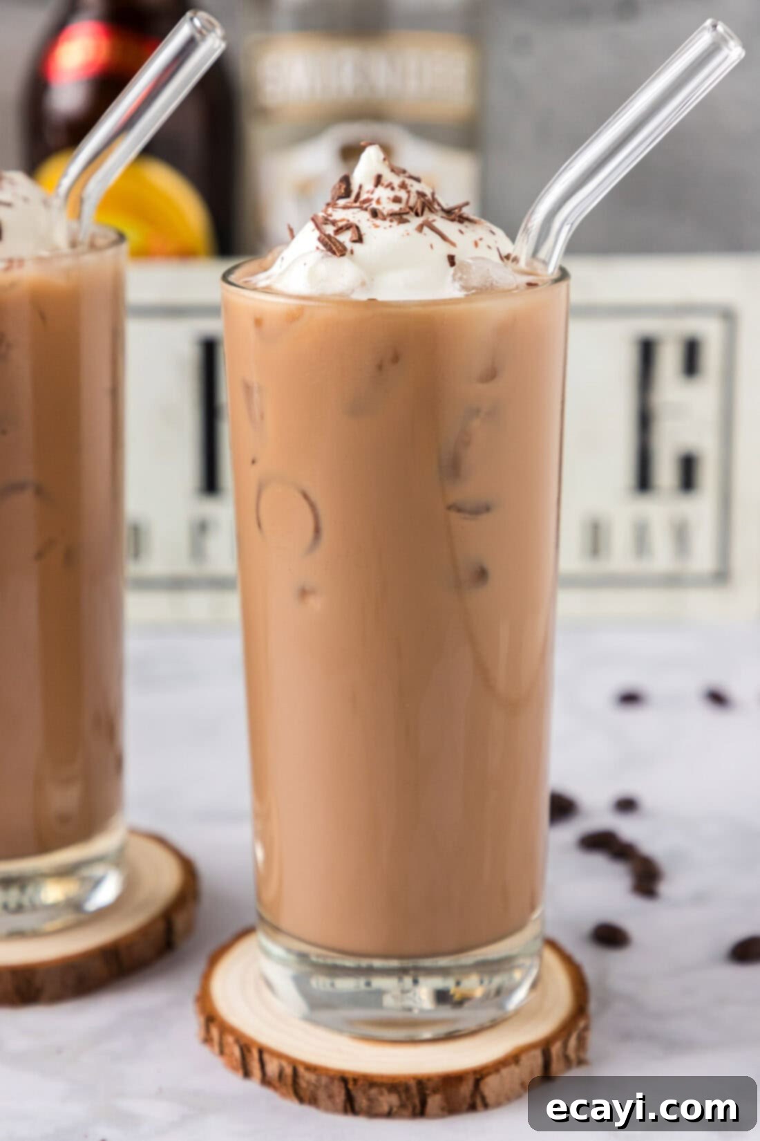 Cold Buzz Coffee 3 Close up photo of a Spiked Iced Coffee in a tall glass, showing ice and layers of coffee and cream.