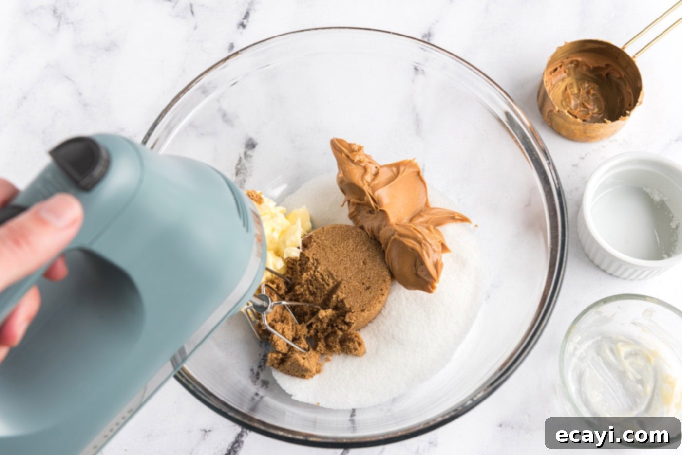 Reese's Peanut Butter Cup Stuffed Cookies 5 peanut butter, sugar, brown sugar, and butter in a mixer bowl