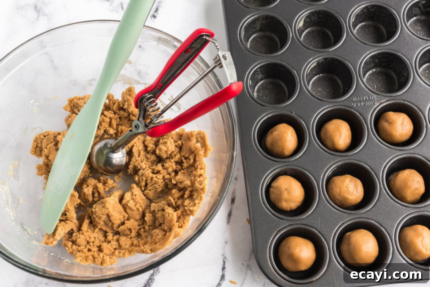 Reese's Peanut Butter Cup Stuffed Cookies 10 scooping 1 inch dough balls into a mini muffin pan