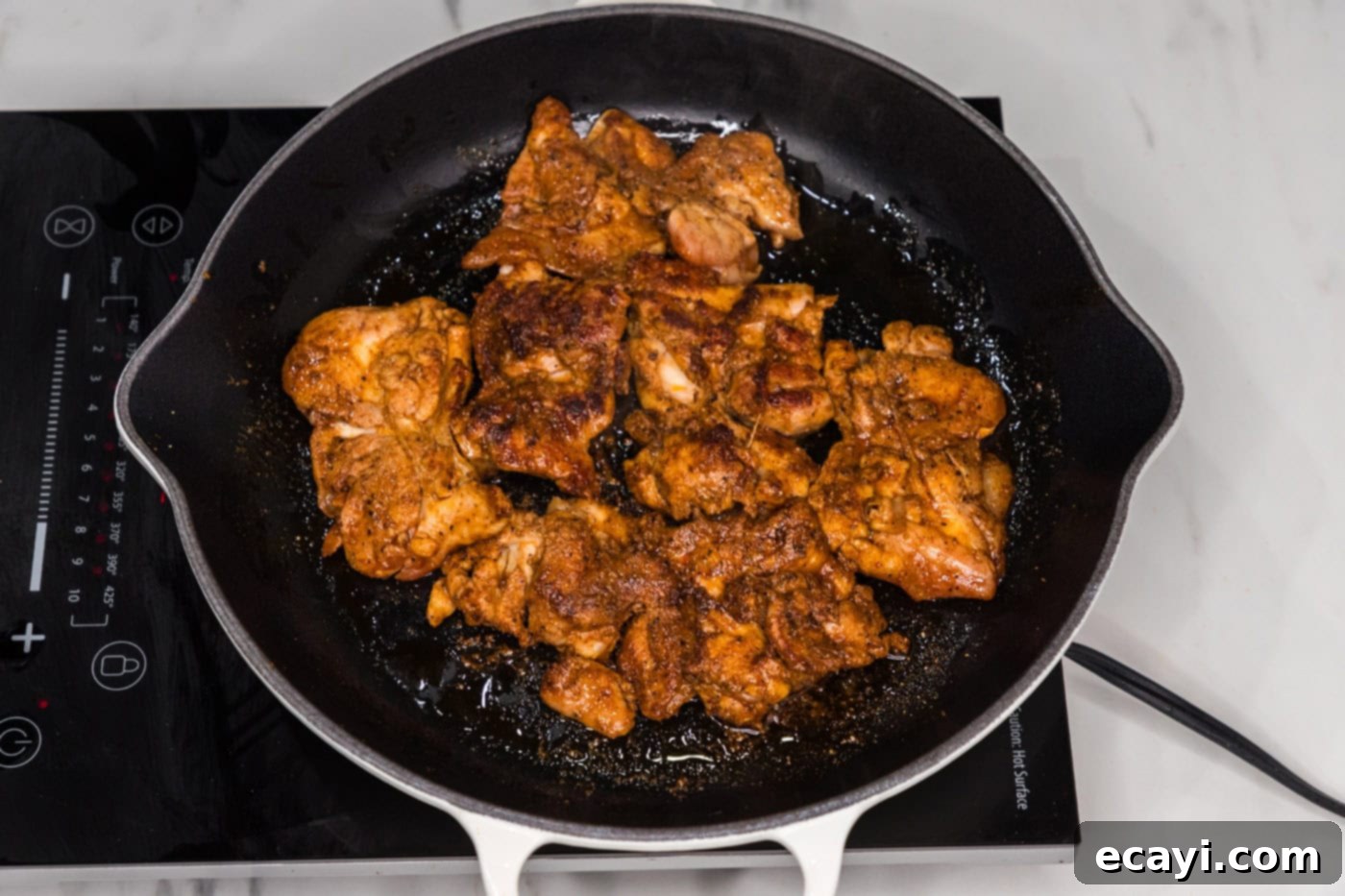Authentic Chicken Shawarma 8 Perfectly cooked chicken shawarma resting in the skillet, displaying its juicy interior and beautifully seared exterior, ready for slicing.