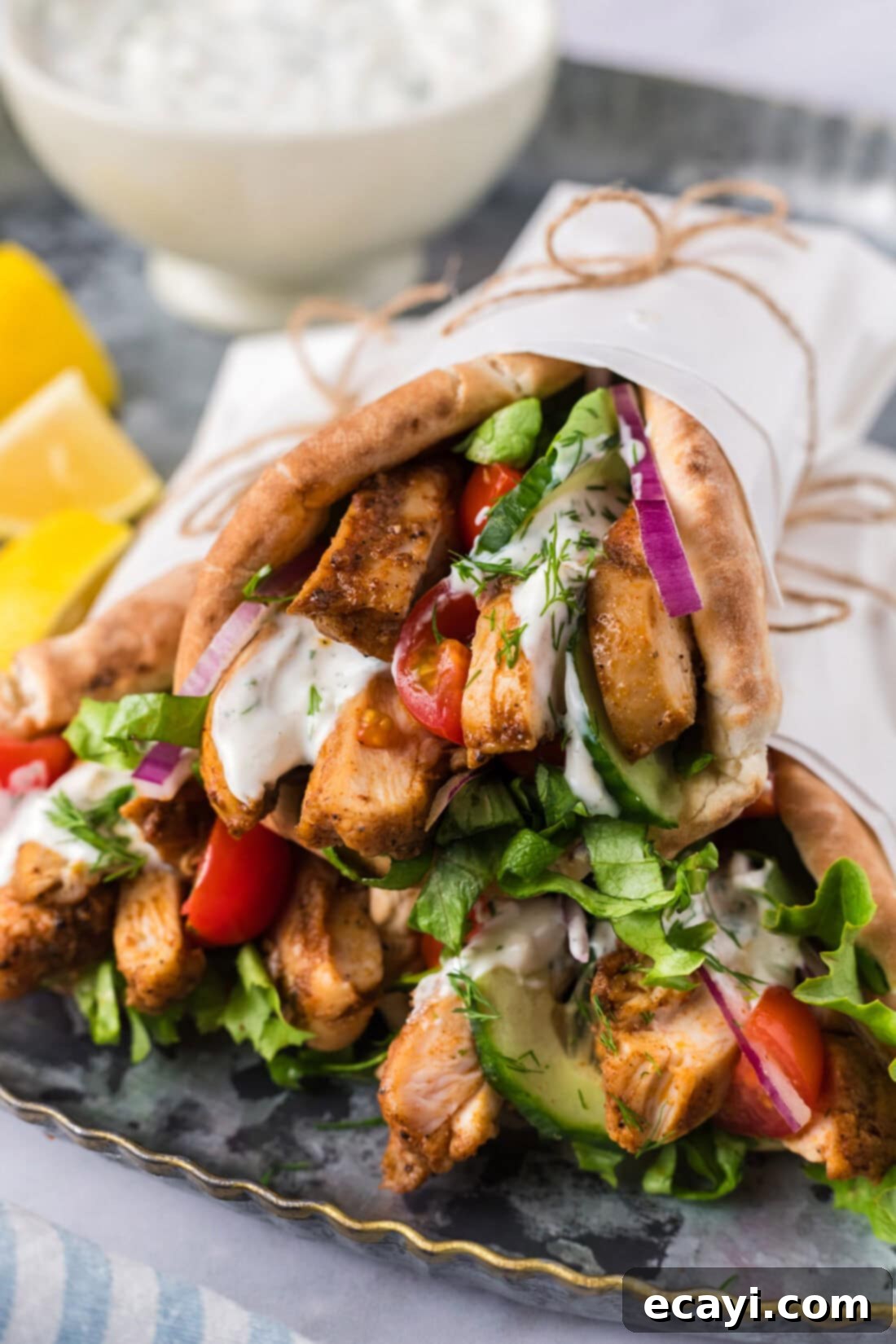 Authentic Chicken Shawarma 10 A beautifully stacked collection of homemade chicken shawarma pita wraps, showcasing their delicious fillings and inviting presentation.