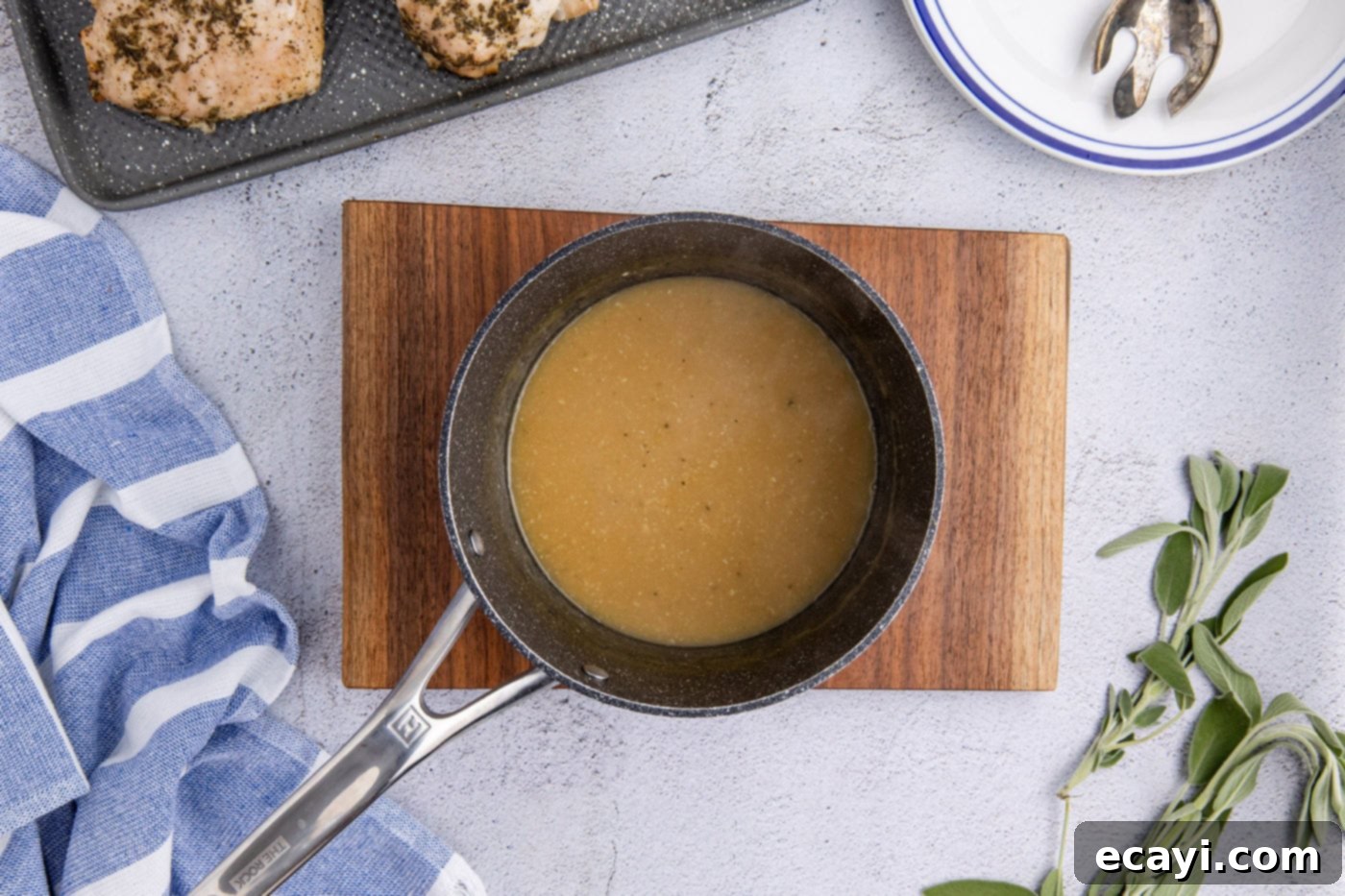 Perfectly Tender Crockpot Turkey Breast 13 Overhead view of a smooth, rich turkey gravy simmering in a saucepan, thickened to perfection.