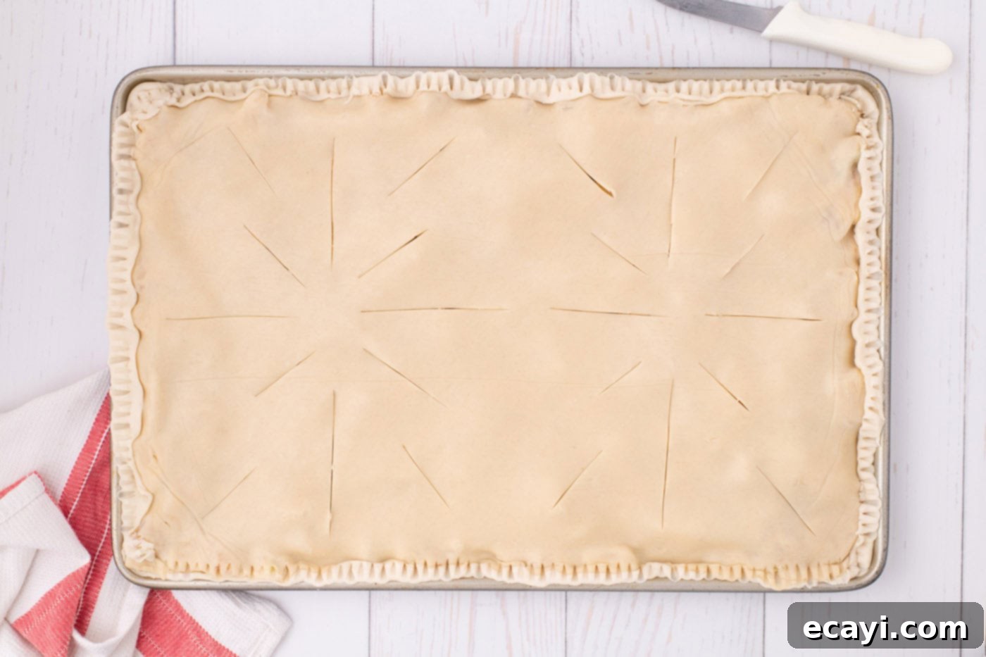 Sheet Pan Apple Pie 13 slits cut on top of slab pie